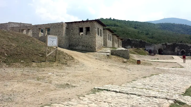 Stone buildings and a cobbled path inside Prizren Fortress